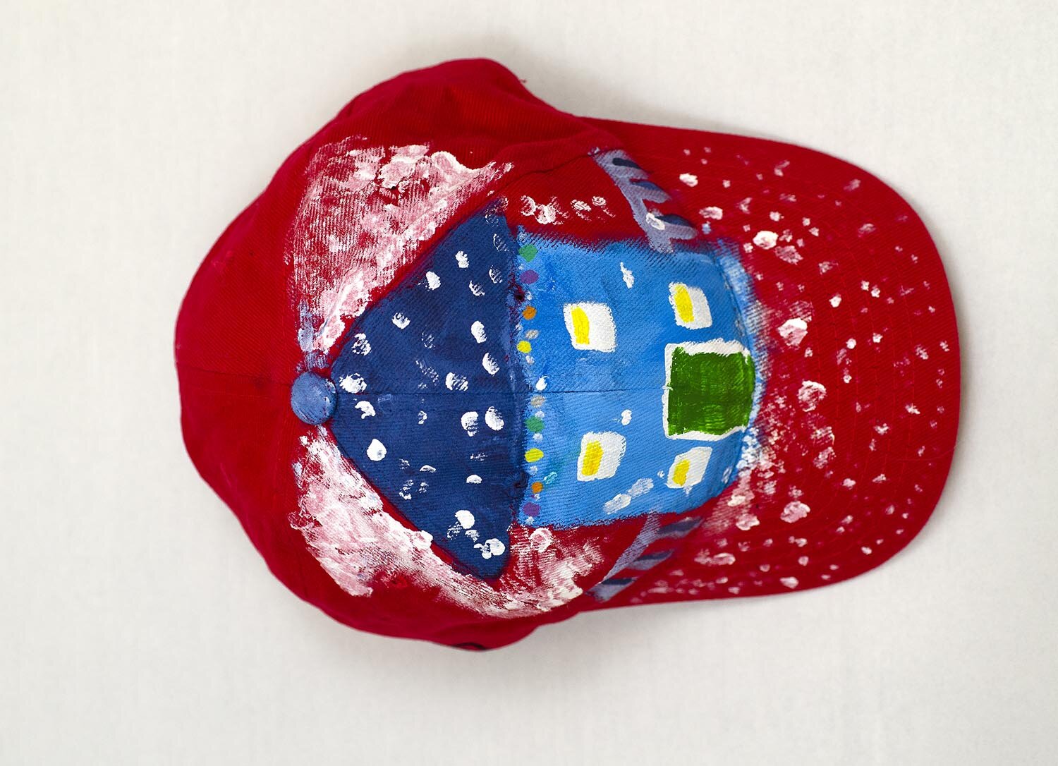 Red Baseball Cap with hand painted Winter House by Mike Hinchcliff