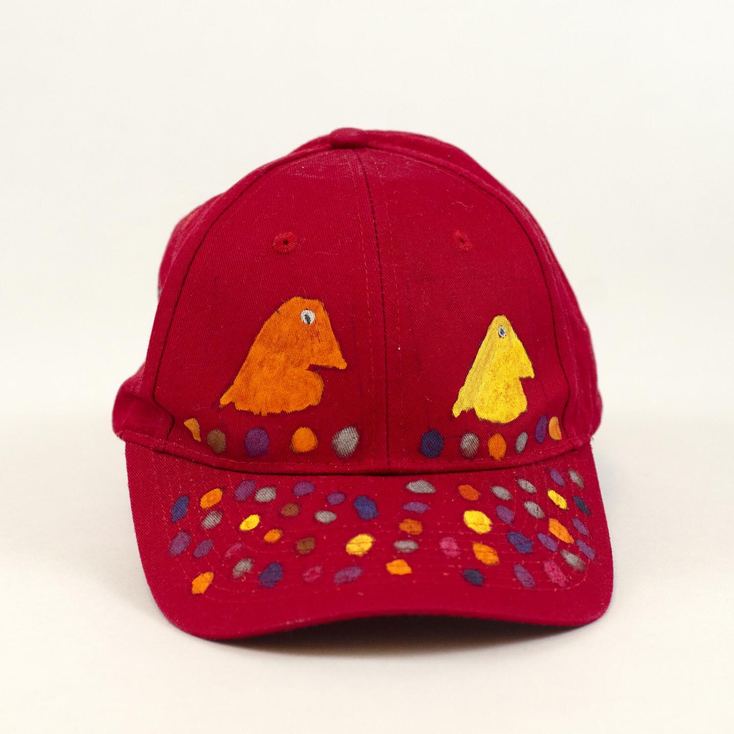 Red Baseball Cap with hand painted Puffins and Eggs by Mike Hinchcliff