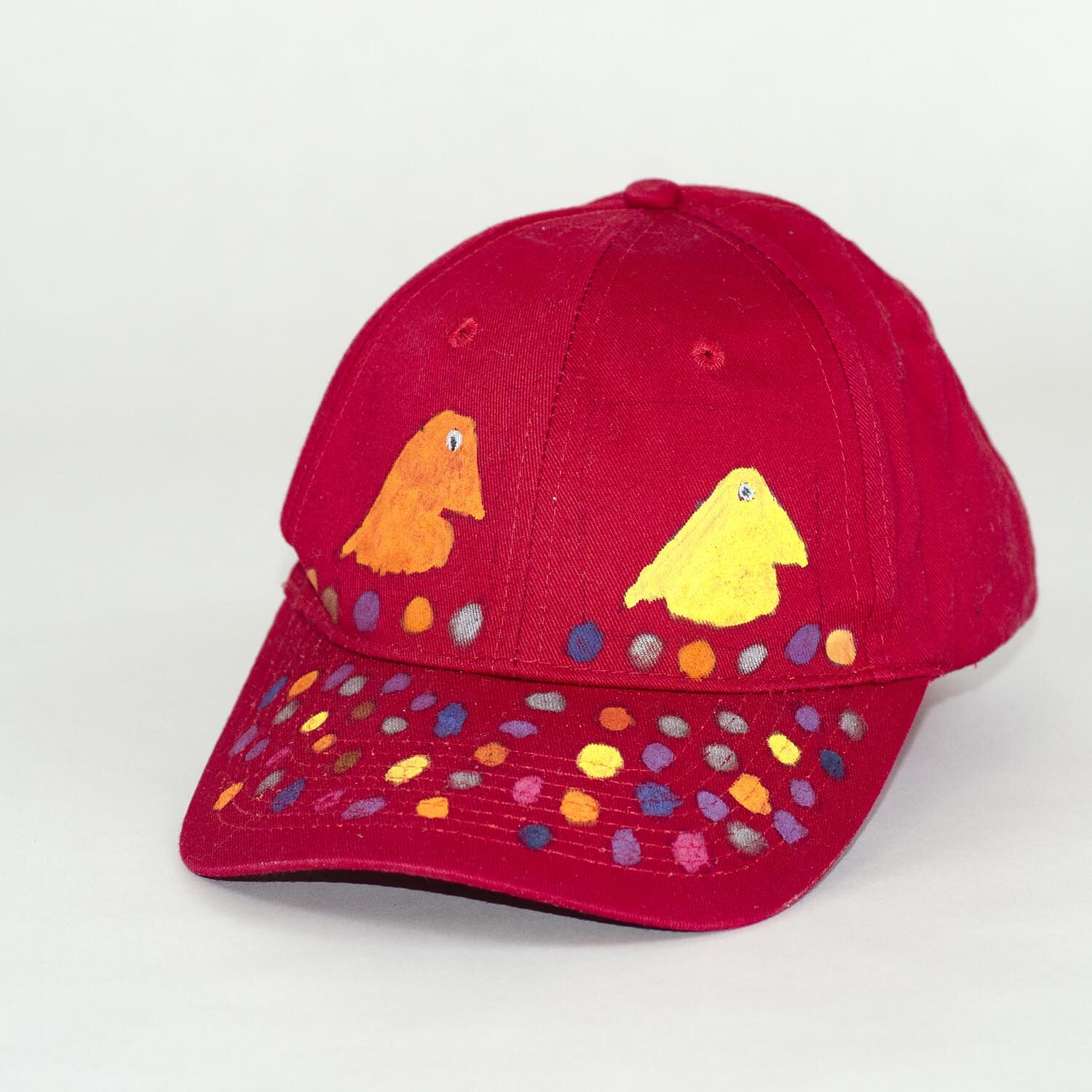 Red Baseball Cap with hand painted Puffins and Eggs by Mike Hinchcliff